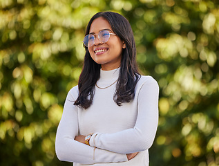 Image showing Thinking, smile and woman with vision in nature during travel, freedom and holiday in New Zealand. Young, happy and girl with idea, arms crossed and pride in a park or garden to relax on vacation