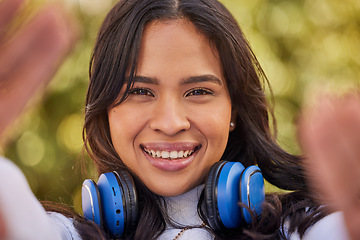 Image showing Selfie portrait of young Indian woman, happy outdoor freedom and weekend lifestyle in Indonesia. Gen z hipster girl streaming podcast, video call of face or relax smile in nature with cool music