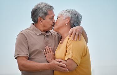 Image showing Love, romance and old couple kiss on marriage anniversary holiday vacation in retirement outdoors. Elderly, trust and senior woman kissing and enjoying romantic quality time with partner in Bogota