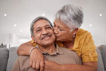 Image showing Senior couple, hug and kiss while bonding on sofa in house or Mexico home living room in safety, love or security. Portrait, smile and happy retirement elderly man and woman with life insurance trust