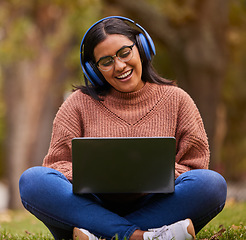 Image showing Laptop, music and girl studying in a park, talking on a video call or learning on internet in Sweden. Happy, smile and relax student reading on pc for education and knowledge with podcast in nature