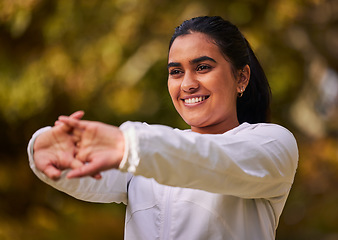 Image showing Fitness, exercise and wellness woman stretching and warm up for workout, running and cardio training outdoor in nature. Happy indian athlete female out for a run in a park for a healthy lifestyle
