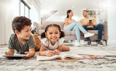 Image showing Happy family, learning and kids on a floor, drawing, bonding and relax with parents on sofa in the background. Children, learning and family quality time in a living room with boy and girl having fun