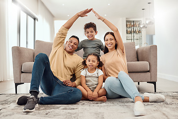 Image showing Roof, children and parents with security in their house with love, care and safety in the living room together. Portrait of happy, smile and young mother and father with insurance for their family