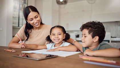 Image showing Family, children and education with a girl, boy and mother doing homework or learning at a dining room table of the home. Kids, love and school with a woman teaching her daughter and son in a house