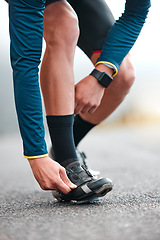 Image showing Road, cycling shoes and man cyclist on a fitness trip for a marathon in the city for training. Sports, exercise and male athlete on outdoor cycle for a cardio workout in the street of an urban town.