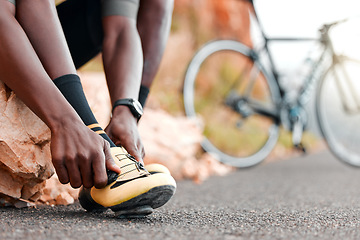 Image showing Fitness, ready and man with cycling shoes by his bicycle starting his workout, cardio exercise and training journey. Sports, healthy and African athlete biker wearing cleats for a road adventure