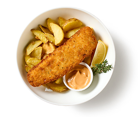 Image showing bowl of breaded fish fillet and fried potato wedges