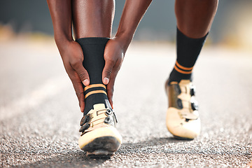 Image showing Foot, pain and man in the road for fitness, cardio or exercise with a medical emergency in the city. Feet, legs and athlete runner training for sports in the road with an injury from a workout or run