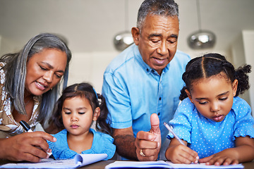 Image showing Homework, writing and grandparents helping children with education together at a table in their house. Girl kids learning in a notebook with a senior man and woman teaching, studying and giving help