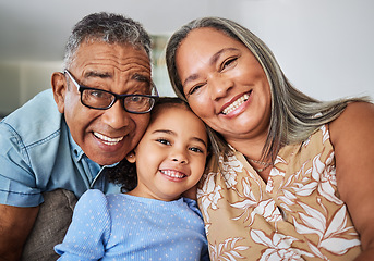 Image showing Family, grandparents and child portrait in a house relaxing, bonding and having fun in retirement on a weekend. Smile, grandma and grandpa hugging and enjoy quality time with a happy girl in Bogota