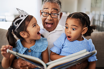 Image showing Family, reading book and children with grandpa for wow, surprised and excited expression in a living room with people bonding. Grandfather or man, kids and story time at home with man and girls