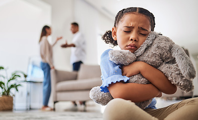 Image showing Parents fight, sad girl and teddy hug of a child crying from divorce in a home living room. Depressed kid, problem and youth anxiety of children depression from mama and dad family fighting