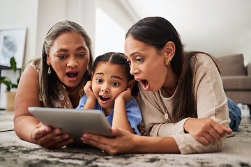 Image showing Digital tablet, family and wow in a living room with multigenerational women bonding on a floor, surprised, shock and excited. Relax, happy family and good news with mother, girl and grandma online