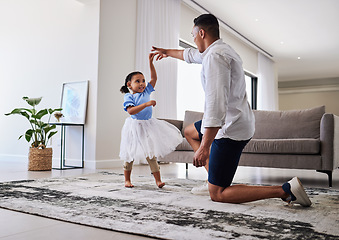 Image showing Family, father and daughter dancing for fun, energy and love in the living room feeling happy holding hands to dance at home. Man or dad and girl child moving to favorite song on fathers day in house