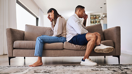 Image showing Fight, frustrated and couple with a problem in their marriage on the living room sofa of their house. Sad, angry and depressed man and woman thinking of divorce, conflict and mistake on the couch