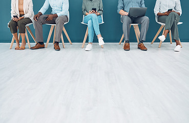 Image showing Business people, legs and job interview wait on technology in studio, startup company or digital marketing office. Men, women and workers line in human resources, global recruitment or hr tech review