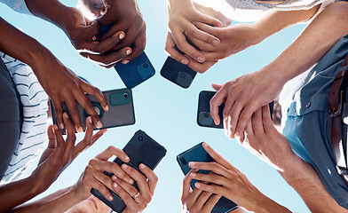 Image showing Circle people, phone hands and social media mobile apps, wifi and digital iot connection on blue sky. Below group social networking, smartphone and 5g internet website for cloud computing technology