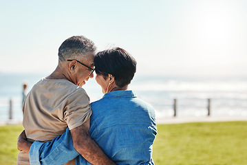 Image showing Hug, love and senior couple at the beach for a holiday in Brazil during retirement in summer. Back of a relax, happy and elderly man and woman hugging with affection on a travel vacation by the sea