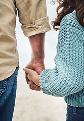 Image showing Hands, family and children with a girl and grandfather holding hands while walking outside on the beach. Kids, love and trust with a senior man and granddaughter hand in hand on a walk outdoor