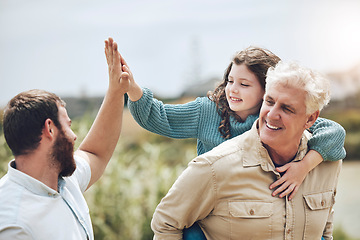 Image showing High five, family adventure and nature hiking with child for outdoor health, wellness and support. Elderly dad and kid walking with goal or success hands sign for travel or fathers day in countryside