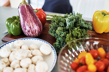 Image showing Vegetables, food and produce to cook for dinner, lunch or breakfast in the kitchen of home. Healthy, organic and raw consumables for health diet or nutrition with mushrooms, peppers and kale on board