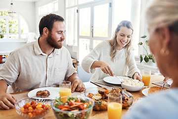 Image showing Food, family and couple eating at a table, happy, relax and bonding in their home together. Lunch, happy family and thanksgiving feast with cheerful people sharing a meal, fresh, cheerful and fun