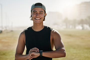 Image showing Young, athlete and sports man happy outdoor in nature tracking fitness time watch after a run. Portrait of training, exercise and workout cardio of a person with health and happiness feeling strong