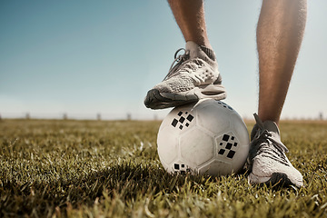 Image showing Soccer, ball and shoes in sport motivation on grass for training, exercise and fitness in the outdoors. Legs of football player standing for healthy sports workout, practice or game on a green field