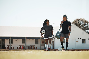Image showing Soccer, sport and couple training for fitness, outdoor cardio and game on a grass field together. Talking, happy and athlete man and woman with football for exercise, workout collaboration and sports