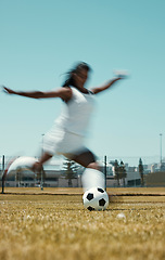 Image showing Motion blur soccer woman kick ball on stadium field, grass and sports competition game to score goals, winning and fitness. Female football athlete action, energy and dynamic shot in outdoor training