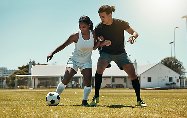 Image showing Man, woman and playing soccer on grass park, stadium field and nature environment in competition match, game and challenge. Fitness friends, sports people and football players in soccer ball training