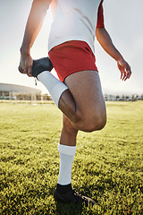 Image showing Exercise, man and athlete doing stretching, prepare for training and practice for soccer game with workout in sportswear on field. Football, wellness and healthy male ready match, fitness and warm up