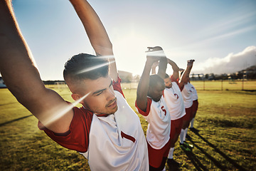 Image showing Men football, team and stretching for fitness, wellness and health on a sports field in the morning. Diversity, exercise and soccer warm up start training healthy body for a game of sport outdoor