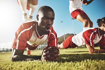 Image showing Sports, soccer and football team doing push up before game, match or tournament for health, fitness and exercise for warm up. Black men, workout and training group on outdoor field for sport practice