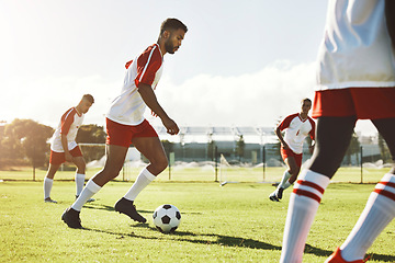 Image showing Team sports game, soccer and teamwork of men busy with football collaboration and workout. Fitness, training and healthy exercise of a healthy athlete ground with fast energy running with a ball