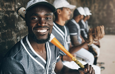 Image showing Baseball, sports and face with a man athlete holding a bat in a dugout with his teammates during a game or match. Portrait, happy and fitness with a baseball player sitting ready to play on the bench
