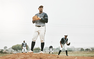 Image showing Sports, baseball and team on field training for game, match or competition. Fitness, exercise and male athlete group, workout or exercise on grass pitch outdoors with pitcher ready to throw ball.