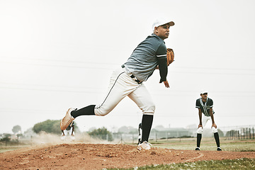 Image showing Baseball, pitch and team sports of a man pitcher busy with teamwork, fitness and fast ball throw. Baseball player training, exercise and workout of a athlete group in a game on a baseball field