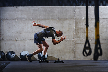 Image showing A fit couple in a modern gym, engaging in running exercises and showcasing their athletic prowess with a dynamic start.