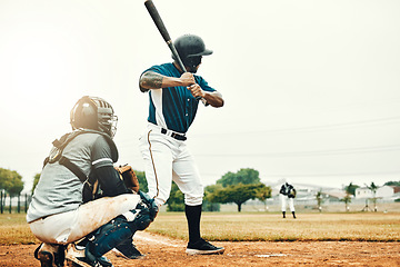 Image showing Baseball man, team training game and baseball player baseball bat to hit softball ball on pitch. Professional USA athlete, focus and motivation on sport field for fitness workout on stadium ground