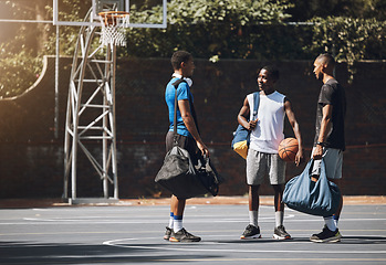 Image showing Basketball, sport and men planning game, training and exercise on a court together. Happy, smile and African friends and team talking before fitness, sports or cardio workout for competition