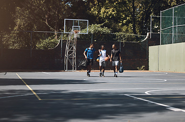 Image showing Basketball court, men and sports team in fitness, workout and training after game, practice and competition match. Talking basketball players, sports people and friends in community wellness exercise