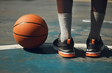 Image showing Basketball, basketball player and athlete legs close up on basketball court outdoors fitness training workout. Young African American man, sports exercise and healthy lifestyle motivation outside