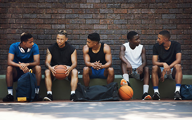 Image showing Basketball, sport team and teamwork break speaking after exercise, workout and fitness. Black team training for sports collaboration and cardio rest together in a conversation about game strategy