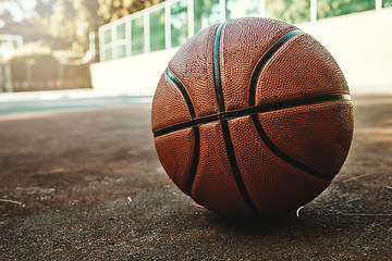 Image showing Basketball sport ball in empty basketball court to play, train and practice for tournament game and training. Summer sports exercise and fitness workout training area, nobody or outdoor competition