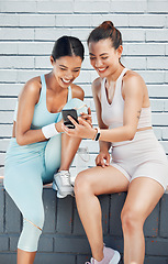 Image showing Women, phone and laughing after city fitness, training and exercise for health, wellness or cardio health. Smile, happy or funny sports friends, people and runners with social media mobile technology