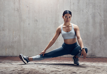 Image showing City fitness, women legs and stretching for cardio exercise, running workout and training in urban outdoors. Portrait of focus asian marathon runner body warm up, balance and wellness energy