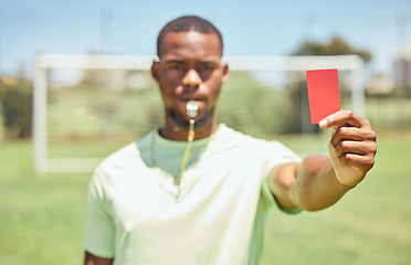 Image showing Soccer, referee and red card on the field during a sports match or training for fitness. Workout, sport and football umpire blowing a whistle for a penalty or wrong move during a game on the pitch.