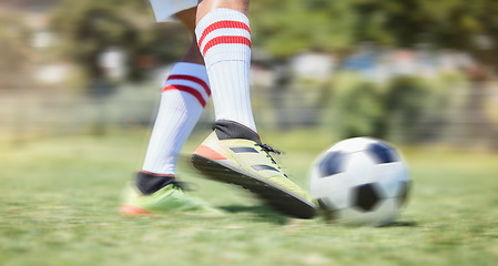 Image showing Soccer, grass and legs kick a football in a training game, practice workout and sports match on soccer field. Fitness, shoes and soccer player in action playing in cardio exercise outdoors in Brazil